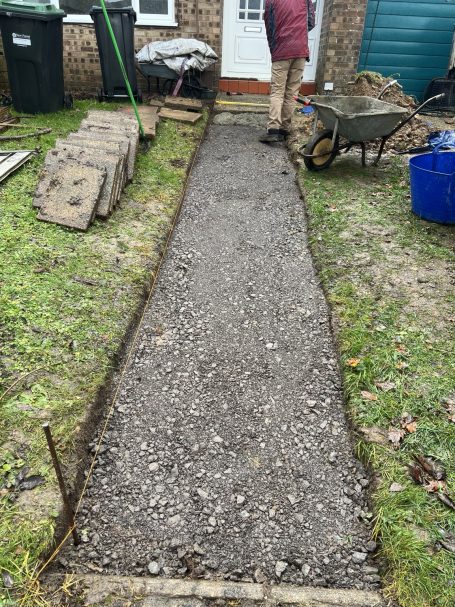 Pathway Re-levelling – Sub-Base Preparation Pathway re-levelling with compacted hardcore sub-base installed